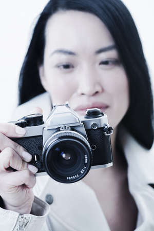 Woman taking pictures with camera