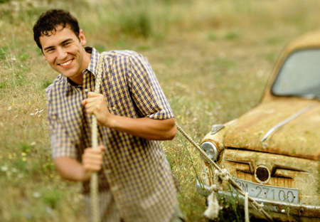 Man pulling carの写真素材