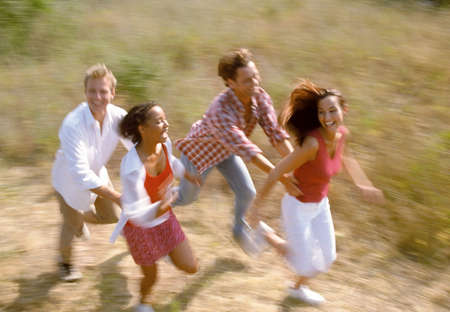Two couples runningの写真素材