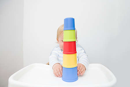 A baby boy playing with building blocksの写真素材