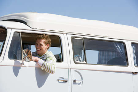 A young man in a camper van