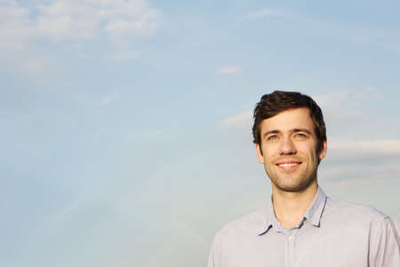 Mid adult man against sky