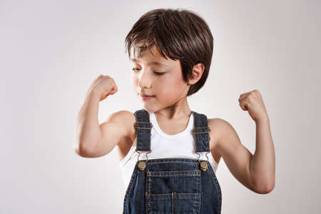 Boy flexing musclesの写真素材