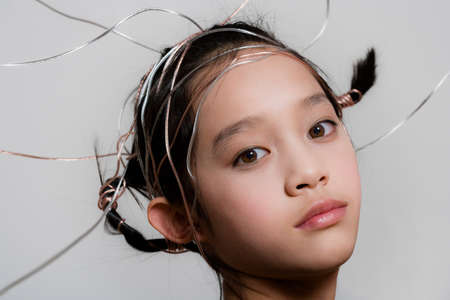 Teenage girl with ribbons in hair