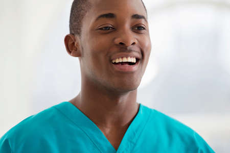 Portrait of young man wearing surgical scrubsの写真素材