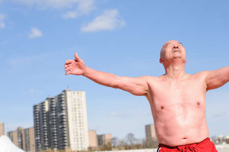 Senior male participant in "polar bear" winter swim, Coney Island, New York, USAの写真素材