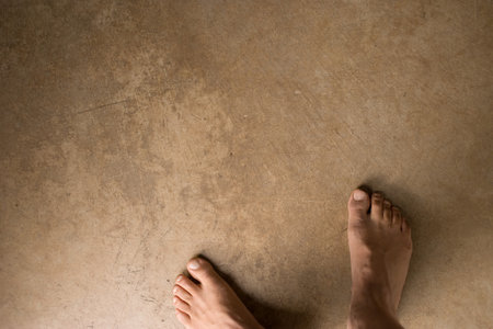 Man's bare feet on concreteの写真素材