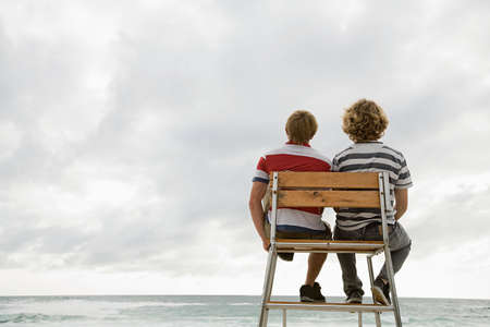 Two boys on lifeguard tower