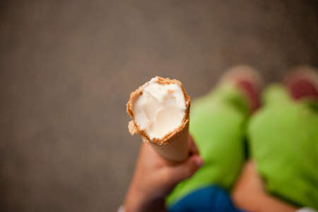 Boy holding ice cream coneの写真素材