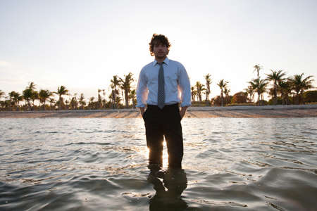 Businessman standing in sea