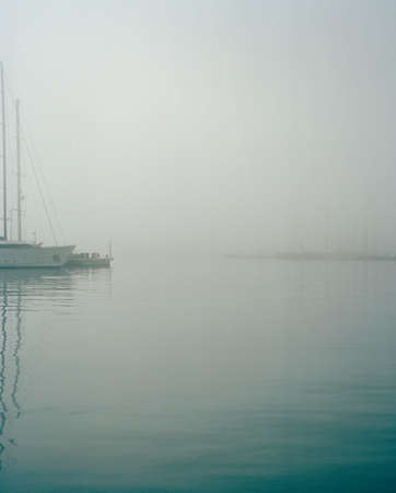 Boats in harbour in fog