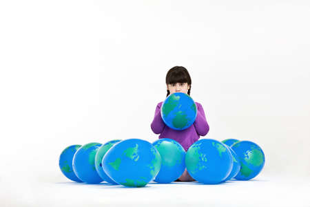 Girl with globe balloons