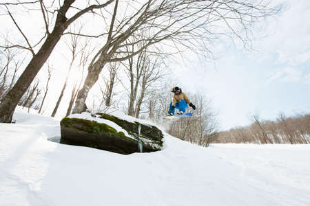 Snowboarder jumping in midair