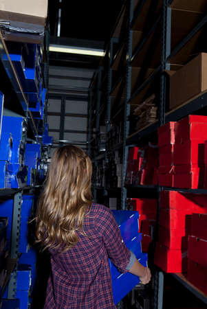 Teenage girl working in stock room