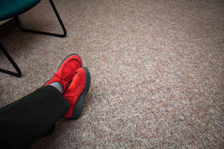 Red shoes in waiting roomの写真素材