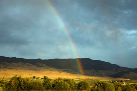 Rainbow over picturesque landscape, British Columbia, Canadaの写真素材