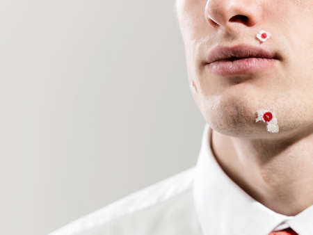 Young man with shaving marks, studio shot