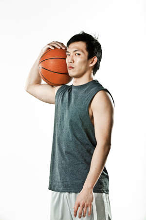 Basketball player holding ballの写真素材