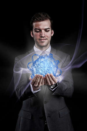 Man holding holographic information ballの写真素材