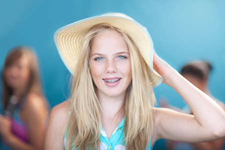 Teenage girl wearing floppy hatの写真素材