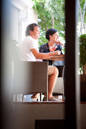 Couple having drinks together on patioの写真素材