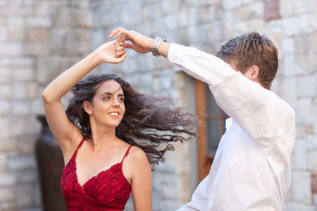 Couple dancing together outdoors