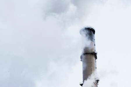 Steam from factory smokestackの写真素材