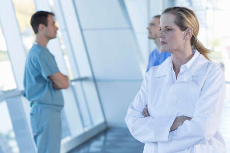 Female doctor with arms folded