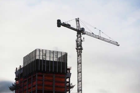 Building under construction with crane, New York City, USA