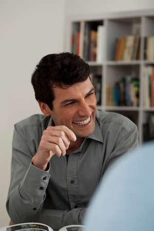 Mid adult man smiling in galleryの写真素材