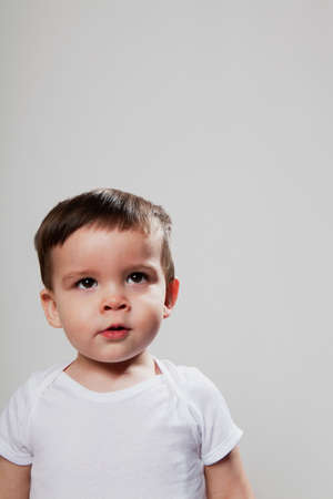Baby boy looking up