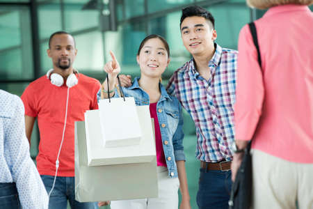 Young couple in shopping mallの写真素材