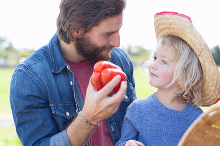 Father and son at farmer's marketの写真素材