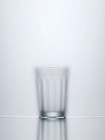Blurred view of water glassの写真素材