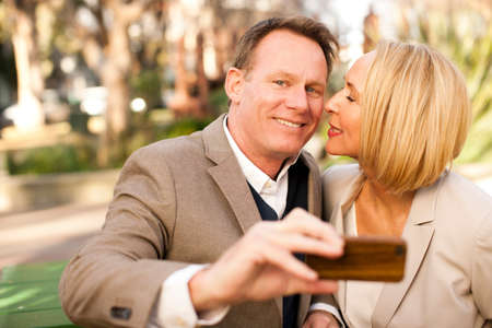 Loving heterosexual couple in parkの写真素材