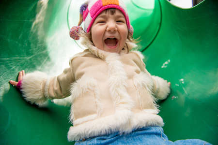 Girl on tube slideの写真素材