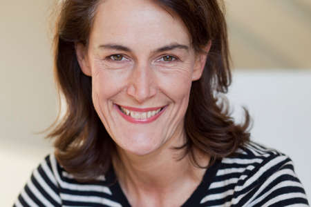 Portrait of woman wearing striped topの写真素材