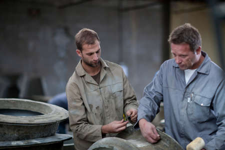 Fetching potters wheel at pottery factory