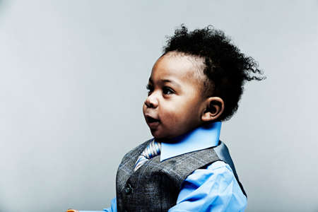 Portrait of baby boy wearing waistcoat, shirt and tieの写真素材