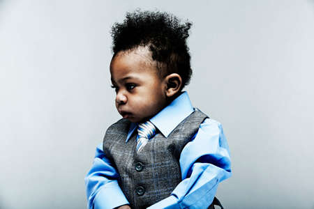 Portrait of baby boy wearing waistcoat, shirt and tieの写真素材