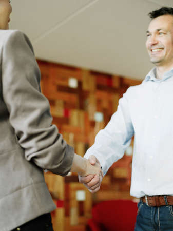 Man and woman shaking hands