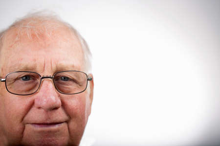 Portrait of senior man wearing glasses, studio shotの写真素材