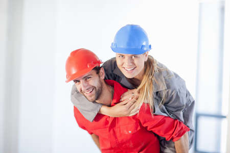 Young couple having fun on construction siteの写真素材