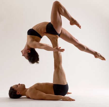 Mid adult couple performing modern danceの写真素材