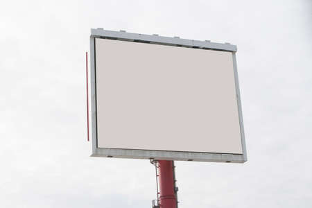 Blank billboard in cloudy skyの写真素材