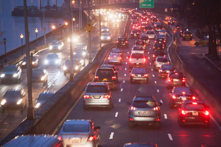Traffic on busy highway at twilightの写真素材