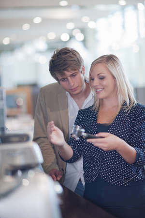 Couple shopping for kitchenware in storeの写真素材