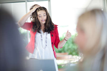 Businesswoman talking in meetingの写真素材