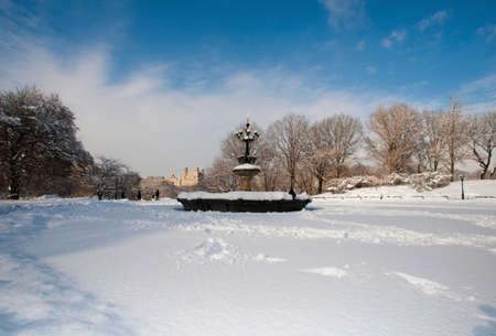 Fountain above Central Park lake in winter, Manhattan, New York City, USAの写真素材