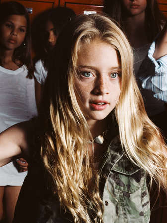 Girl in school locker room, portraitの写真素材